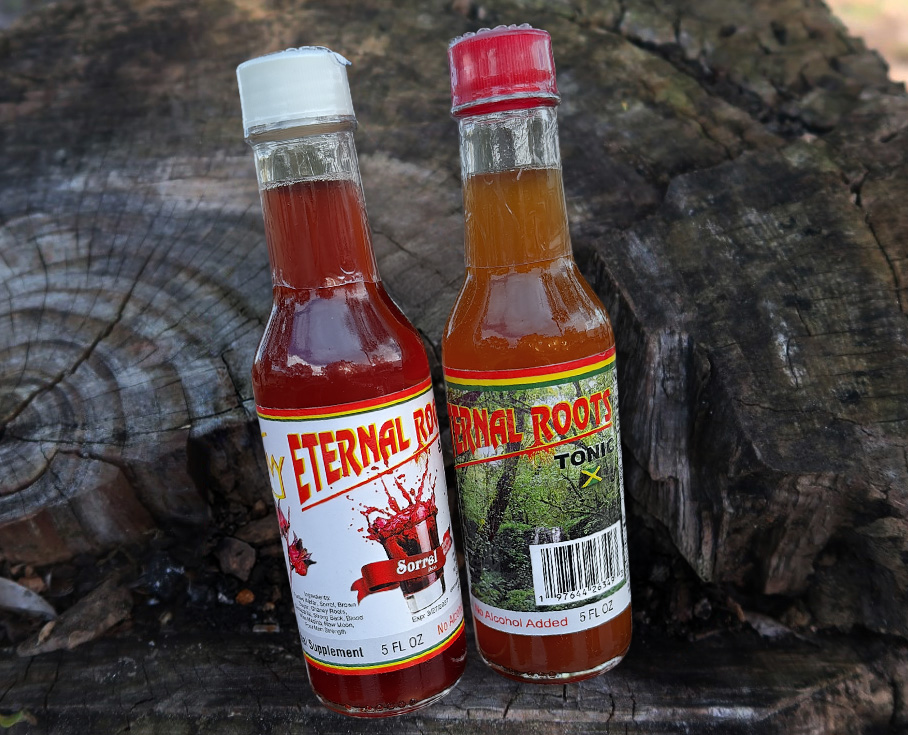 Two bottles of My Eternal Roots herbal tonic on a bark background, showcasing our story and tradition of natural Jamaican roots.